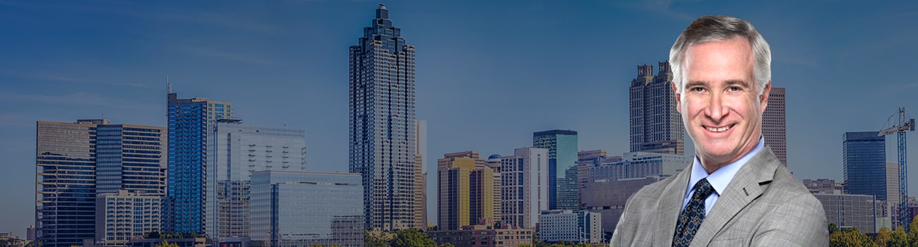 Hero Banner - Attorney Picture over skyline of Atlanta
